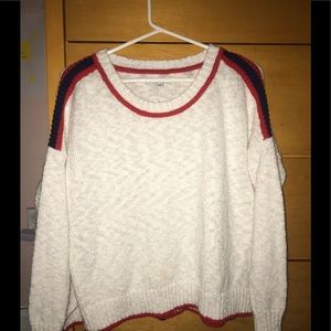 White sweater with red and blue accents